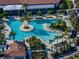 Large, inviting pool with plenty of lounge chairs and tropical landscaping at 16931 Scuba Crest St, Wimauma, FL 33598