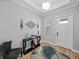 Bright entryway with console table and modern wall decor at 16931 Scuba Crest St, Wimauma, FL 33598
