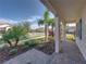 Brick paved porch with tropical landscaping and view of the street at 16931 Scuba Crest St, Wimauma, FL 33598