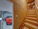 Unfinished wooden stairs leading to additional storage above the garage at 16931 Scuba Crest St, Wimauma, FL 33598