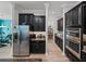 Stainless steel appliances and ample cabinetry in this kitchen at 16931 Scuba Crest St, Wimauma, FL 33598