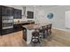 Kitchen with dark cabinetry, granite countertops and island at 16931 Scuba Crest St, Wimauma, FL 33598