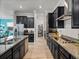 Modern kitchen with stainless steel appliances and granite countertops at 16931 Scuba Crest St, Wimauma, FL 33598