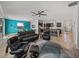 Spacious living area with open floor plan and views of the kitchen and dining areas at 16931 Scuba Crest St, Wimauma, FL 33598