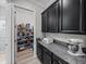 Walk-in pantry with ample shelving for storage at 16931 Scuba Crest St, Wimauma, FL 33598