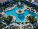 Aerial view of resort-style pool with surrounding lounge areas at 16931 Scuba Crest St, Wimauma, FL 33598