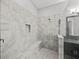 Large walk-in shower with tiled walls and seat at 16931 Scuba Crest St, Wimauma, FL 33598