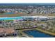 Aerial view of community amenities including a surf pool and expansive parking at 16931 Scuba Crest St, Wimauma, FL 33598