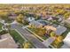 Aerial view of a house nestled in a quiet, tree-lined neighborhood at 1811 Stonebrook Ln, Safety Harbor, FL 34695