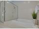 Spa-like bathroom featuring a soaking tub and a separate shower at 1811 Stonebrook Ln, Safety Harbor, FL 34695