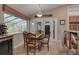Charming breakfast nook with table and chairs, adjacent to the kitchen and backyard at 1811 Stonebrook Ln, Safety Harbor, FL 34695