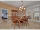 Bright dining room, featuring a wood table and chairs, and access to other rooms at 1811 Stonebrook Ln, Safety Harbor, FL 34695