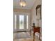Bright and spacious entryway with a wooden console table at 1811 Stonebrook Ln, Safety Harbor, FL 34695