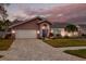 Attractive house with a paved driveway and well-manicured lawn at 1811 Stonebrook Ln, Safety Harbor, FL 34695