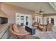 Relaxing patio with wicker furniture and a fire pit at 1811 Stonebrook Ln, Safety Harbor, FL 34695