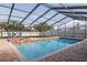 Inviting screened pool and spa with brick pavers at 1811 Stonebrook Ln, Safety Harbor, FL 34695