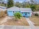 Aerial view of a light blue house with a small yard at 1841 Overbrook Ave, Clearwater, FL 33755