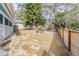 Large backyard with fire pit and wood fence at 1841 Overbrook Ave, Clearwater, FL 33755