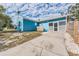 Light blue house exterior with driveway at 1841 Overbrook Ave, Clearwater, FL 33755