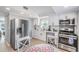 Modern kitchen with stainless steel appliances and white cabinets at 1841 Overbrook Ave, Clearwater, FL 33755