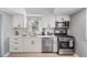 Modern kitchen with white cabinets and stainless steel appliances at 1841 Overbrook Ave, Clearwater, FL 33755
