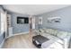 Living room with sofa, coffee table, and flat-screen TV at 1841 Overbrook Ave, Clearwater, FL 33755