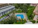 Lush green landscape with a corner pool and residential buildings at 2700 Bayshore Blvd # 6308, Dunedin, FL 34698