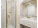 Bathroom with shower, sink, and ornate mirror at 2700 Bayshore Blvd # 6308, Dunedin, FL 34698