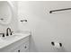 White bathroom vanity with marble countertop at 2700 Bayshore Blvd # 6308, Dunedin, FL 34698