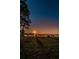 Sunset view over calm water and grassy beach at 2700 Bayshore Blvd # 6308, Dunedin, FL 34698
