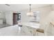 Dining area features marble table and chandelier at 2700 Bayshore Blvd # 6308, Dunedin, FL 34698