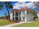 Two-story building with red tile roof and landscaping at 2700 Bayshore Blvd # 6308, Dunedin, FL 34698