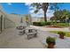 Community patio with tables, benches, and umbrellas at 2700 Bayshore Blvd # 6308, Dunedin, FL 34698