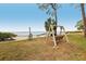 Relaxing waterfront view with a wooden swing at 2700 Bayshore Blvd # 6308, Dunedin, FL 34698