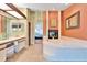 Bathroom with double vanity, jetted tub and fireplace at 2913 Aston Ave, Plant City, FL 33566