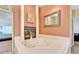 Relax in this bathroom's luxurious corner jacuzzi tub, complete with a fireplace for ultimate comfort at 2913 Aston Ave, Plant City, FL 33566