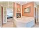 Spacious bathroom with corner jacuzzi tub and fireplace at 2913 Aston Ave, Plant City, FL 33566