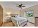 Guest bedroom with light wood bed frame and ceiling fan at 2913 Aston Ave, Plant City, FL 33566