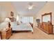 Main bedroom with wooden furniture and carpet flooring at 2913 Aston Ave, Plant City, FL 33566