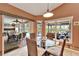 Bright dining area with glass table and chairs, overlooks pool and patio at 2913 Aston Ave, Plant City, FL 33566