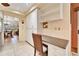 White kitchen cabinets and built-in workspace at 2913 Aston Ave, Plant City, FL 33566