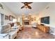 Living room with hardwood floors, fireplace, and lots of natural light at 2913 Aston Ave, Plant City, FL 33566