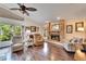 Relaxing living room with hardwood floors and a cozy fireplace at 2913 Aston Ave, Plant City, FL 33566