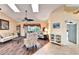 Bright living room with hardwood floors, vaulted ceilings, and access to the lanai at 2913 Aston Ave, Plant City, FL 33566