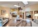 Spacious living room with hardwood floors, vaulted ceilings, and skylights at 2913 Aston Ave, Plant City, FL 33566