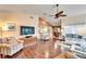 Open living room with hardwood floors, fireplace, and view to kitchen at 2913 Aston Ave, Plant City, FL 33566