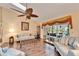 Open living room with hardwood floors, vaulted ceilings, and pool access at 2913 Aston Ave, Plant City, FL 33566