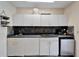Small outdoor kitchen with stainless steel appliances at 2913 Aston Ave, Plant City, FL 33566