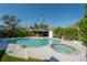 Resort-style backyard boasts a large pool, spa, and ample space for entertaining at 3611 W De Leon St, Tampa, FL 33609