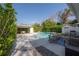 Inviting backyard oasis with a sparkling pool, patio, and covered seating area at 3611 W De Leon St, Tampa, FL 33609